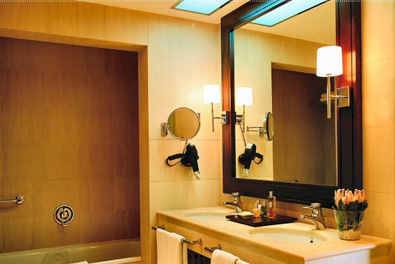 Bathroom scene with a large wall mirror